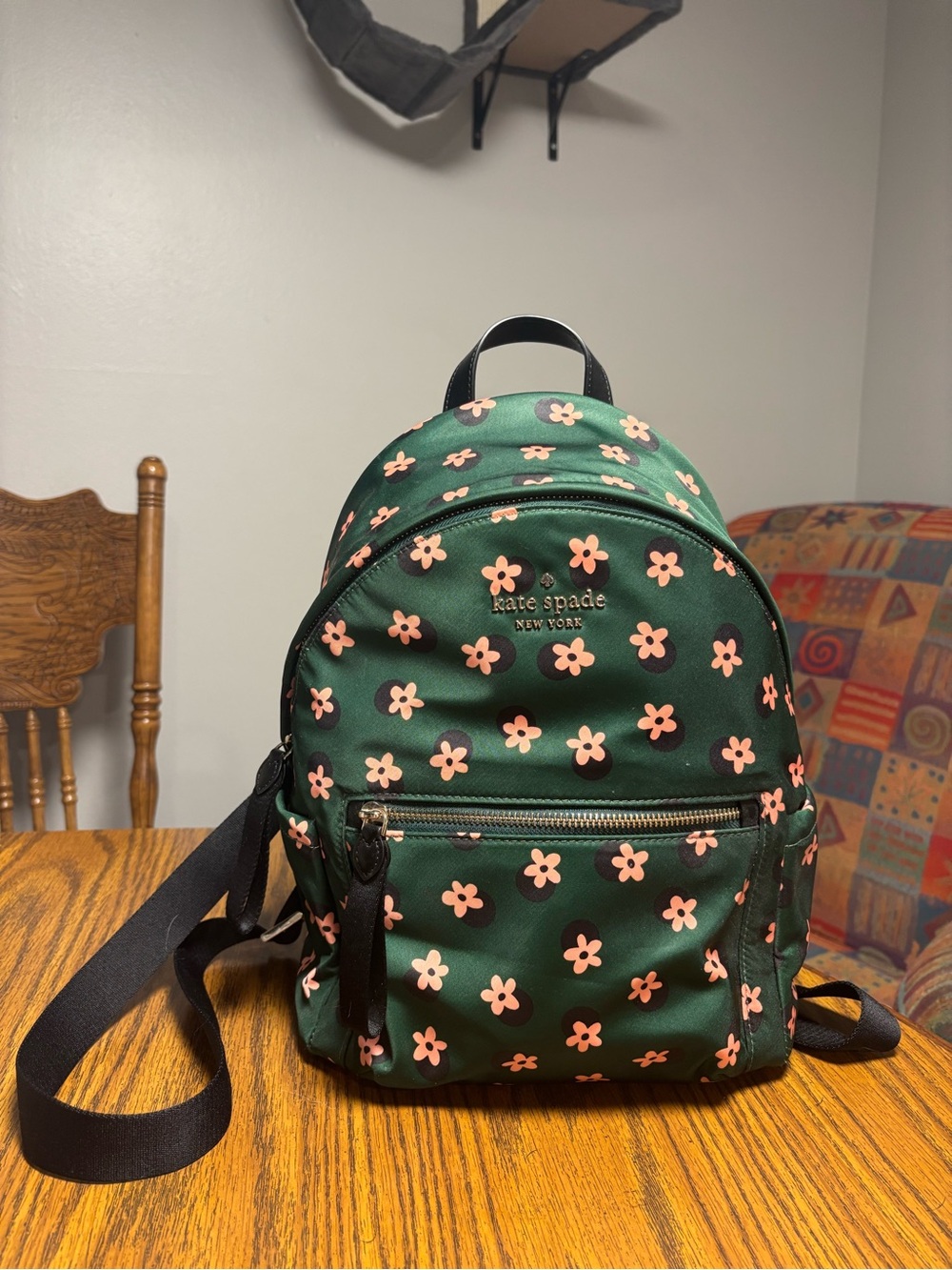 kate spade dark green backpack with pink floral print